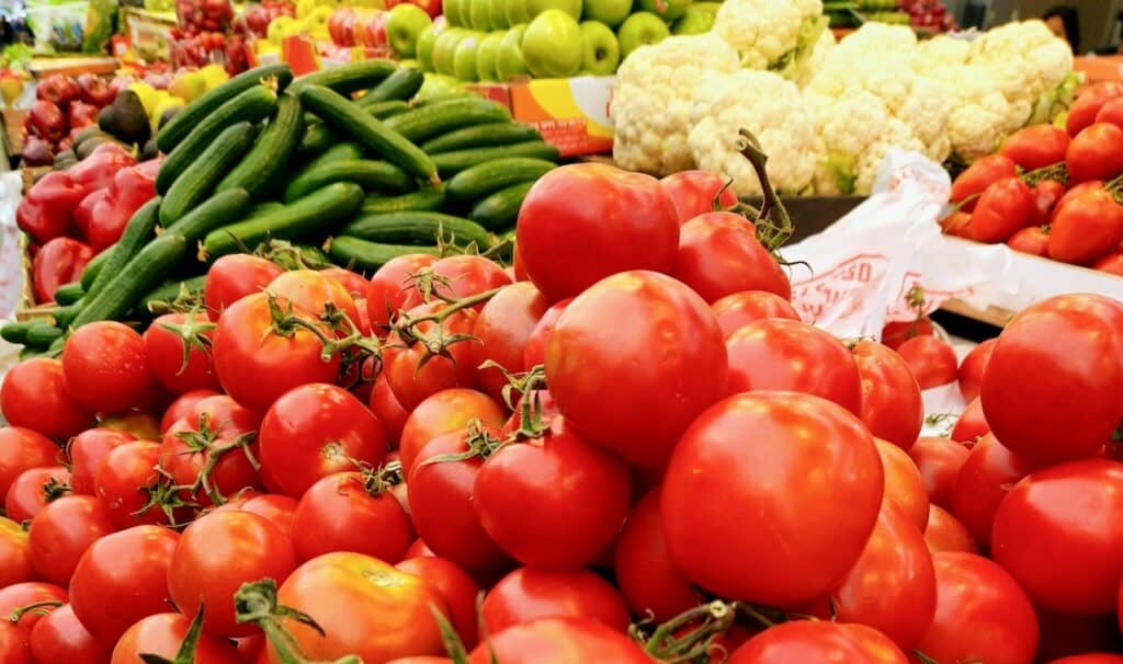 Tomatoes and cucumbers at a market - vegetables that authorities warned of after deadly E.coli outbreak in Europe