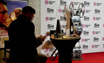 A movie goer at the SIE Film Center, Denver's only independent cinema