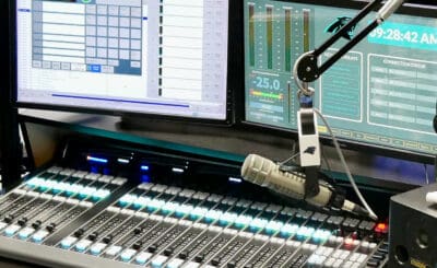 Monitor and a microphone in a broadcast journalism studio